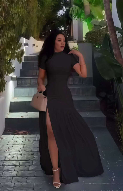 Black maxi dress with short sleeves, fitted bodice, A-line skirt and high slit