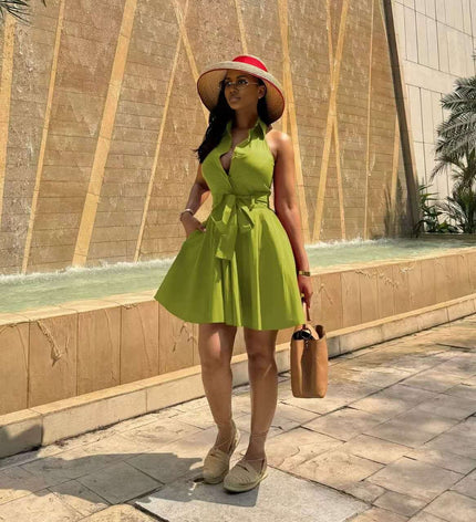 Yellow-green sleeveless tie-waist A-line dress with halter neckline and flared skirt