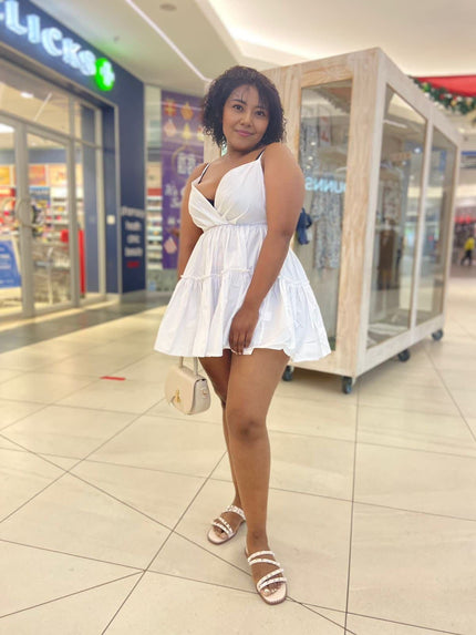 White mini ruffle V-neck dress with twisted neckline and tiered skirt