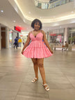 Pink mini ruffle V-neck dress with twisted V neckline and tiered skirt