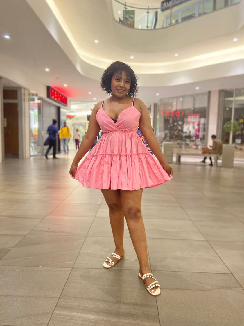 Pink mini ruffle V-neck dress with twisted V neckline and tiered skirt