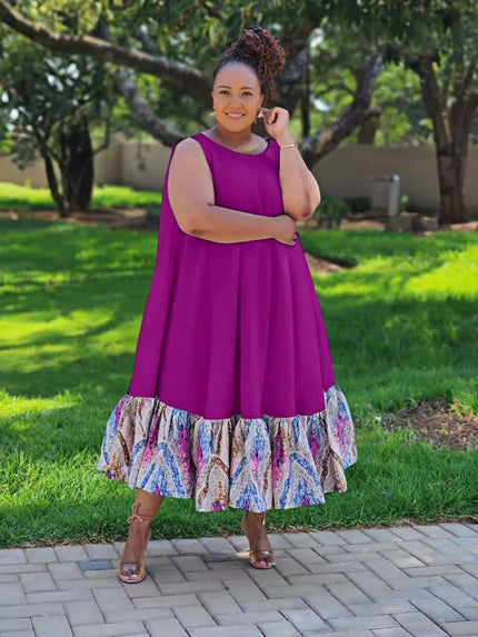 Plus-size sleeveless midi dress with ruffle hem; purple bodice, multicolor floral skirt