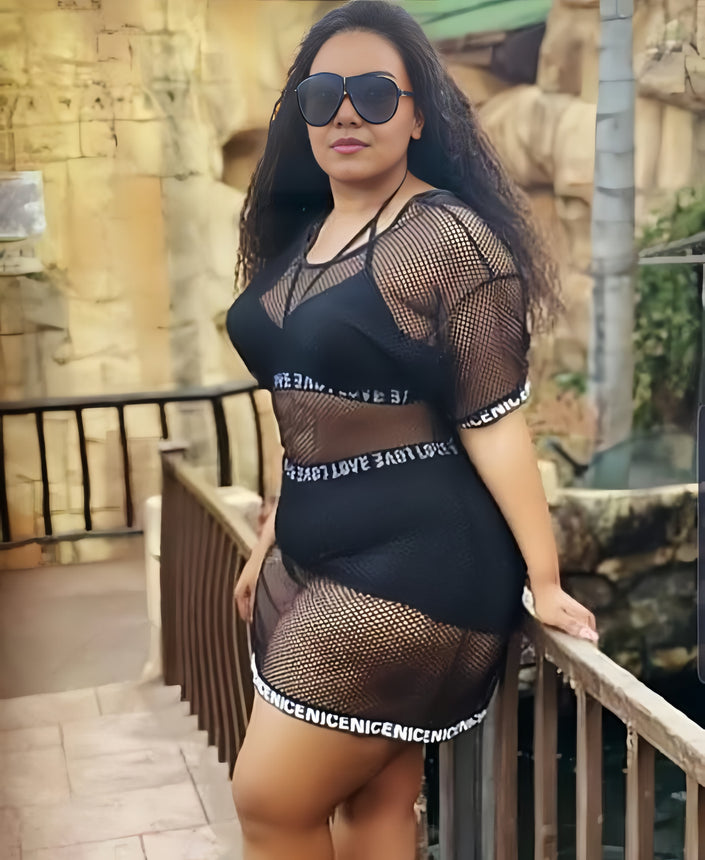 Black mesh coverup skirt with long sleeves over a black bikini set