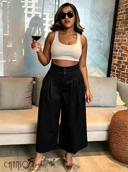 Black pleated wide-leg culottes with stretch waistband and button front