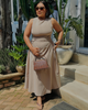 Beige sleeveless midi dress with side ruching and adjustable waist tie