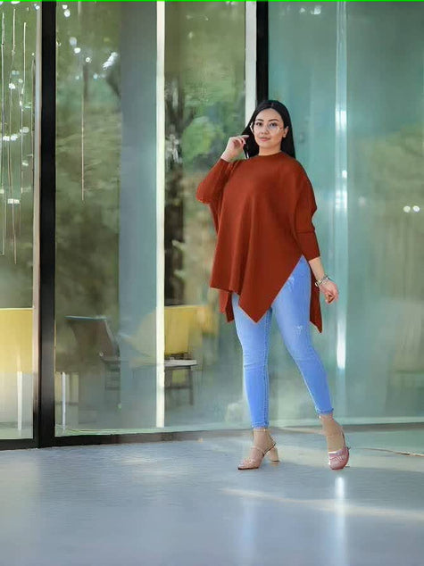 Asymmetrical loose knit top, orange-red, batwing sleeves with angled bottom