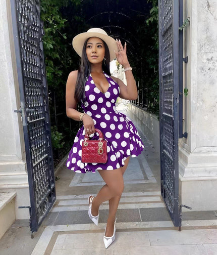 Purple polka dot mini dress with flared skirt and V-neckline