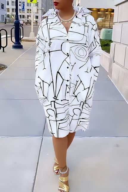 White shirt dress with black geometric line pattern, button front, long sleeves