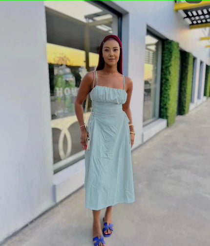 Light-blue ruched midi dress with spaghetti straps and adjustable stretch waist