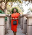 Orange V-neck button-front midi dress with short sleeves and center buttons