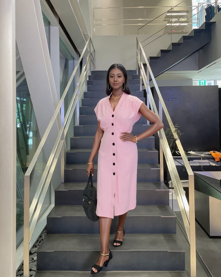 Pink V-neck button-front midi dress with short sleeves and center button placket