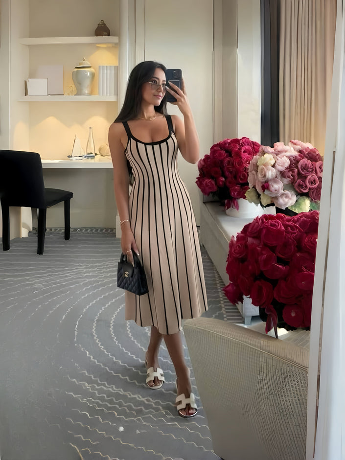 Knitted midi dress with cream base and black vertical stripes, scoop neckline, thin straps