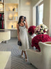 Knitted midi dress with black vertical stripes, scoop neckline and thin straps