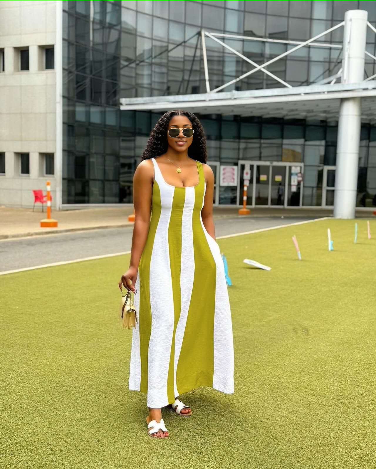 Sleeveless maxi dress with white vertical stripes over green paneling, wide scoop neck