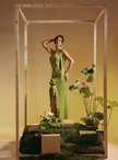 Lime green halter maxi dress with rose appliqué and flowing ruffled skirt