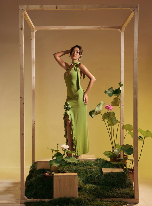 Lime green halter maxi dress with rose appliqué and flowing ruffled skirt