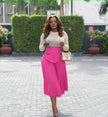 Hot-pink pleated A-line midi skirt with stretch waist and layered front panel