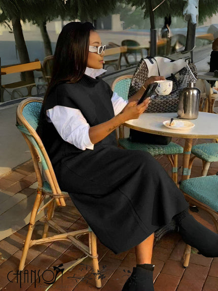 Layered knit dress with sleeveless loose fit, black; high neckline and midi flare