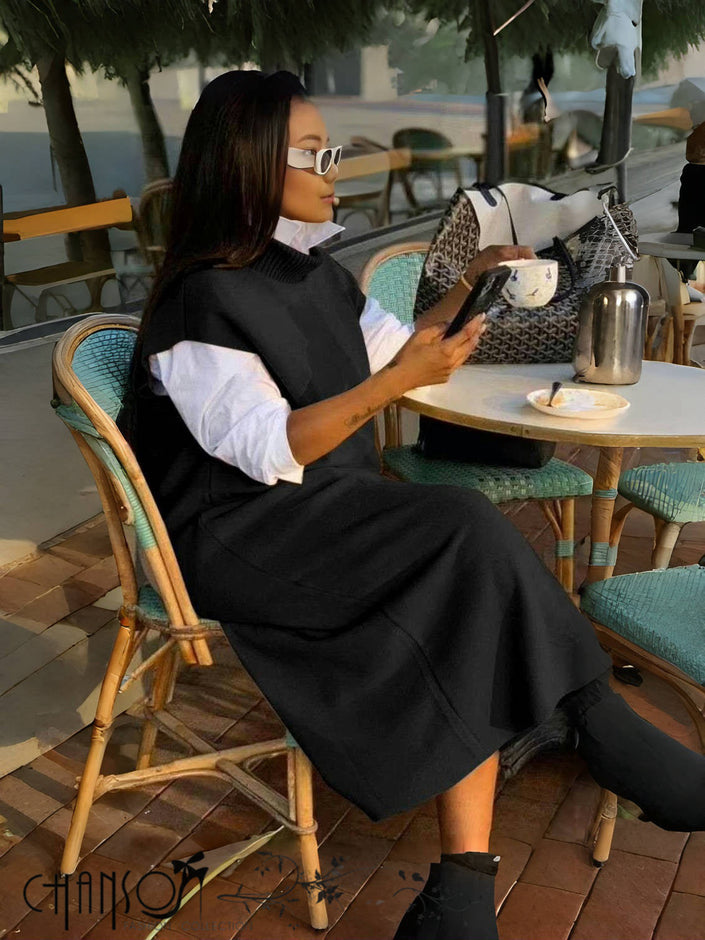 Layered knit dress with sleeveless loose fit, black; high neckline and midi flare