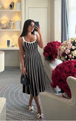 Knitted midi dress with black and white vertical stripes, scoop neckline and thin straps