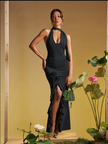 Black halter maxi dress with ruffle skirt and rose appliqué detail