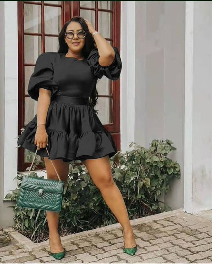 Black puff sleeve mini dress with tiered ruffle hem and gathered waist