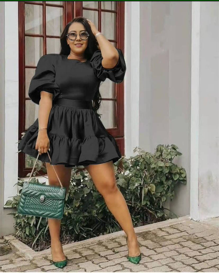 Black puff sleeve mini dress with tiered ruffle hem and gathered waist