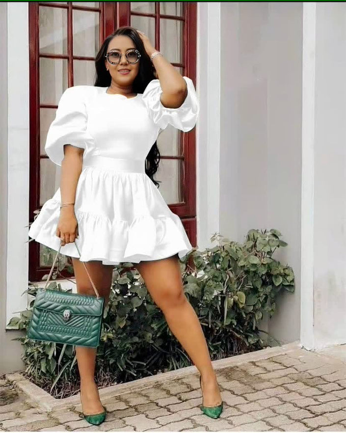 White puff sleeve mini dress with tiered ruffle hem and gathered skirt