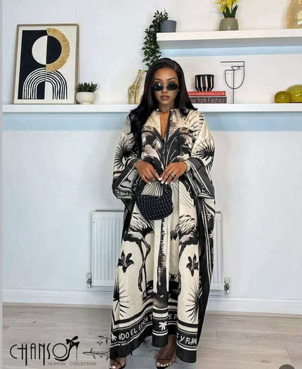 Kaftan dress, black-and-white tropical leaf print, loose maxi silhouette with V neckline