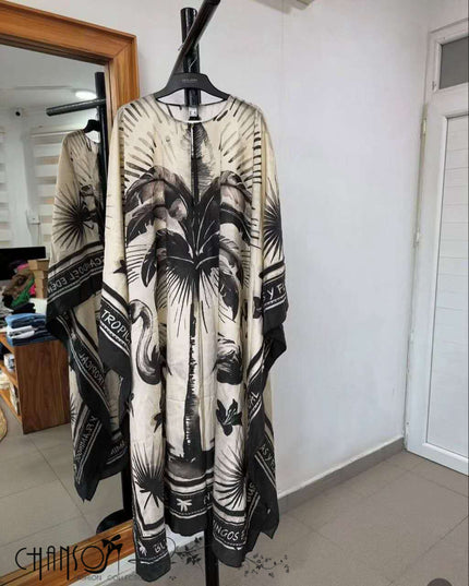 Kaftan dress, black-and-white tropical leaf print with V neckline and wide sleeves