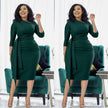 Slim-fit midi dress in dark green with waist tie and pleated waist shaping