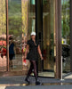 Black collared shirt dress with cinched waist and button front, mini length