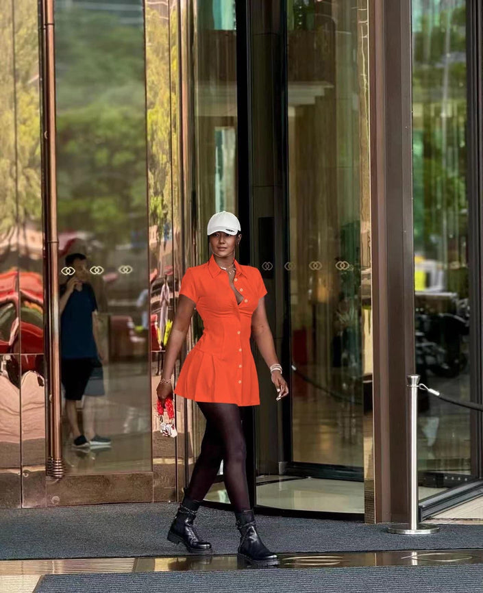 Orange-red collared shirt dress with cinched waist and button front, mini length