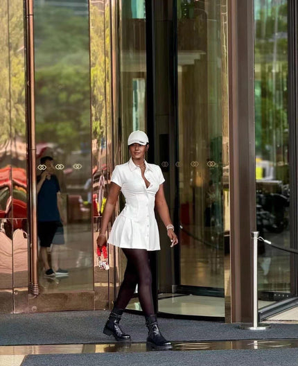 White collared shirt dress with cinched waist and button front, mini length