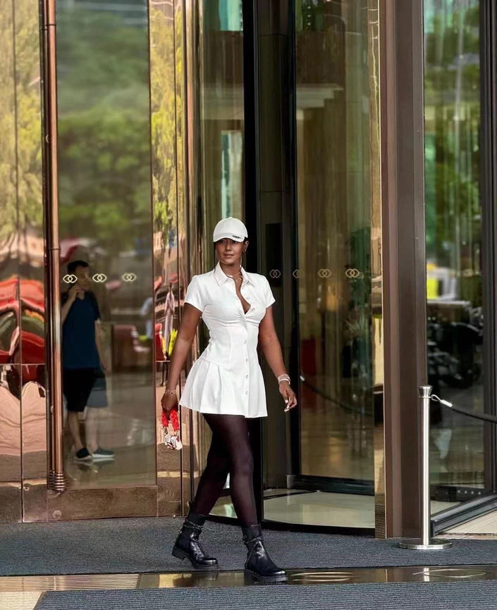White collared shirt dress with cinched waist and button front, mini length