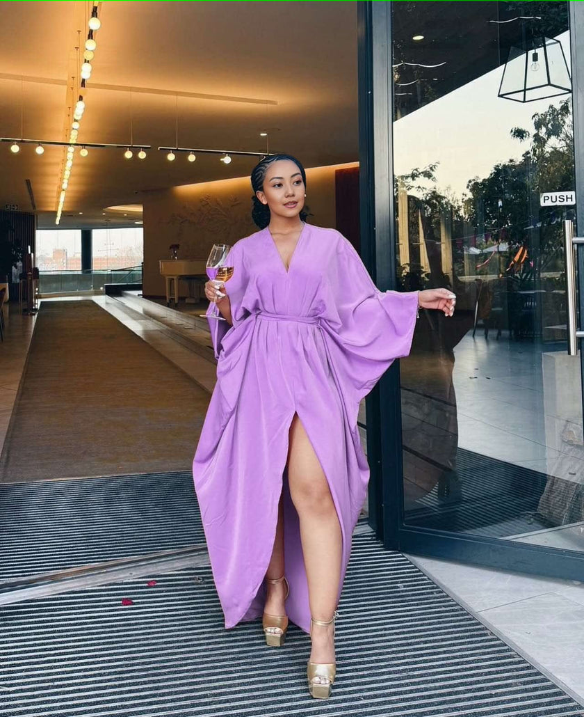 Light-purple loose-fit maxi dress with V-neck, long sleeves, waist tie, and front split hem