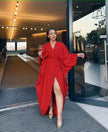 Red loose-fit maxi dress with V-neck, long sleeves, waist tie, and front split hem