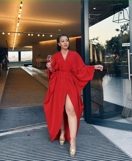 Red loose-fit maxi dress with V-neck, long sleeves, waist tie, and front split hem