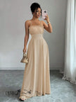 Tan pleated maxi dress with spaghetti straps, smocked bodice and long flowing skirt
