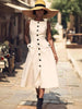 Cream sleeveless midi button dress with flap pockets and peplum-style waist