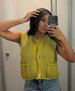 Yellow-green knit sleeveless vest with button front and two patch pockets