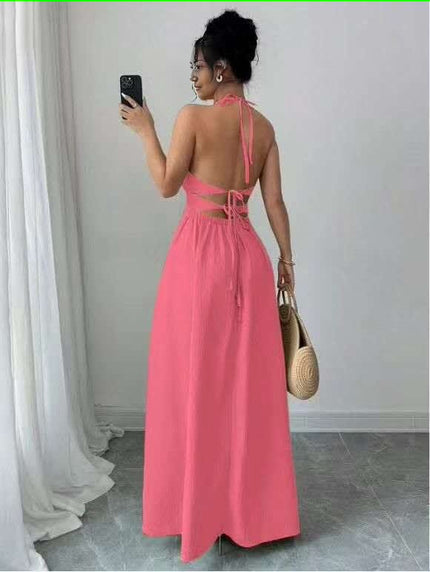 Pink halter midi dress with back cutout and flared skirt