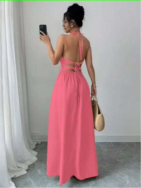 Pink halter midi dress with back cutout and flared skirt