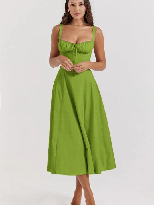 Green-yellow midi dress with spaghetti straps, ruched bust, and cinched waist