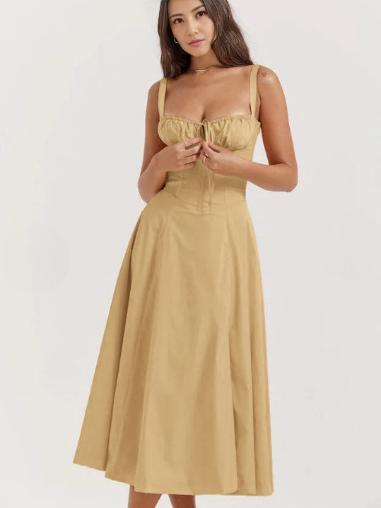 Light goldenrod midi dress with spaghetti straps, ruched bust, and cinched waist
