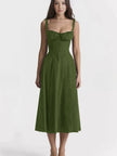 Dark-green midi dress with spaghetti straps, ruched bust, and cinched waist