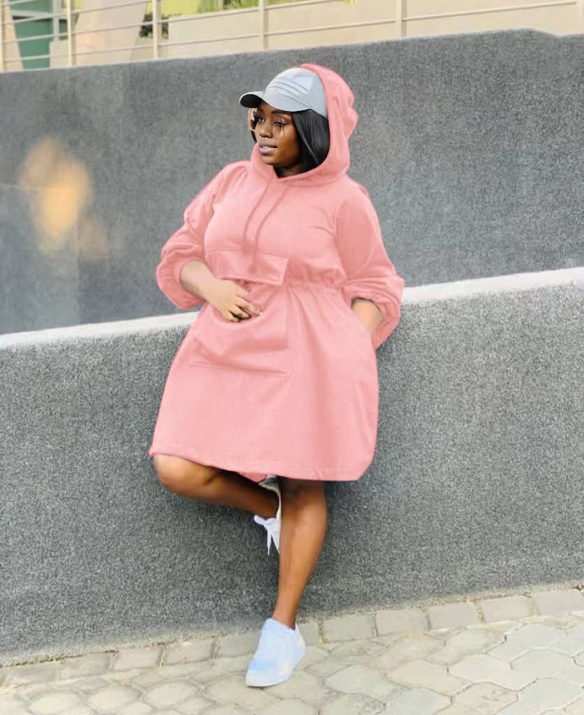Pink oversized hoodie dress with front pouch pocket and hood, long sleeves