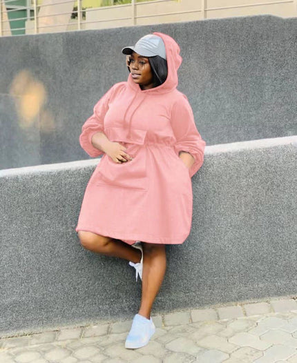 Pink oversized hoodie dress with front pouch pocket and hood, long sleeves