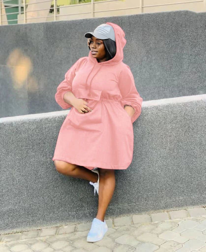 Pink oversized hoodie dress with front pouch pocket and hood, long sleeves
