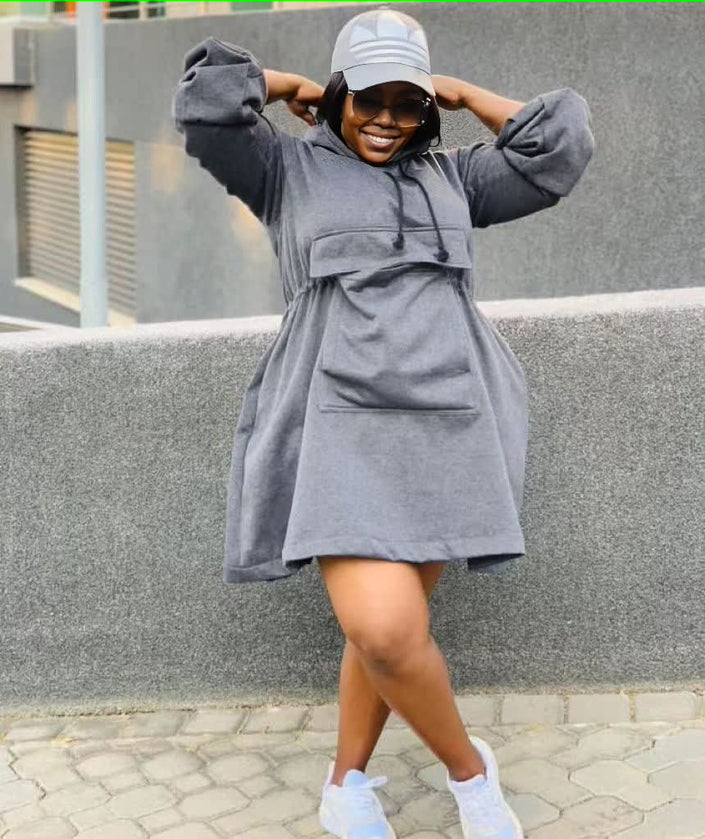 Grey oversized hoodie dress with front pouch pocket, hood, and long sleeves